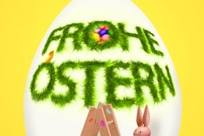 Osterhase bemalt ein Ei